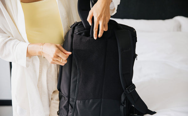 A person stowing away the Edgeless Straps on the Techonaut 30.